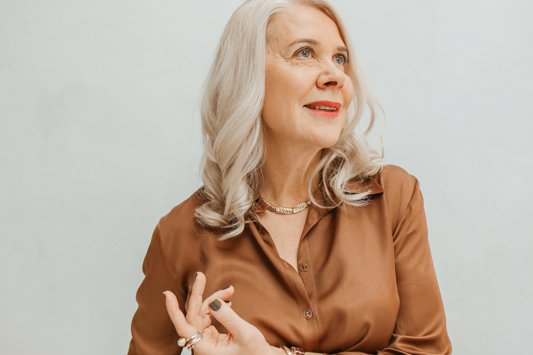 Stylish Mature Woman in Brown Dress Shirt